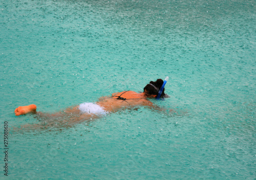 Swimming in a mask in the Maldives in the rain