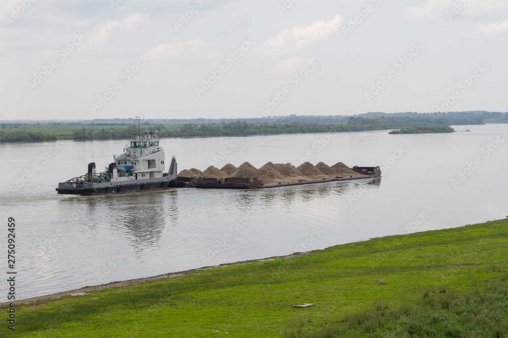 barge with sand on the Irtysh River