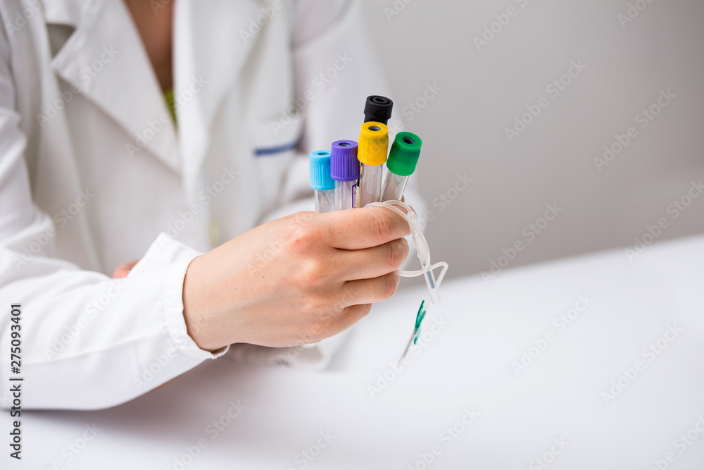 Doctor holding Blood test tubes and equipment Doctor holding Blood test tubes and equipment