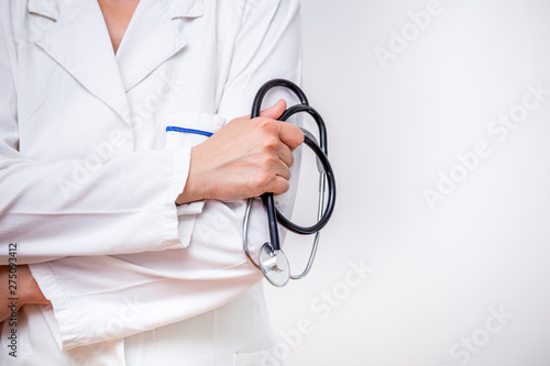 Doctor holding Stethoscope on white background