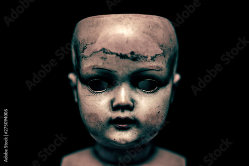 Fotobehang Creepy doll in the dark