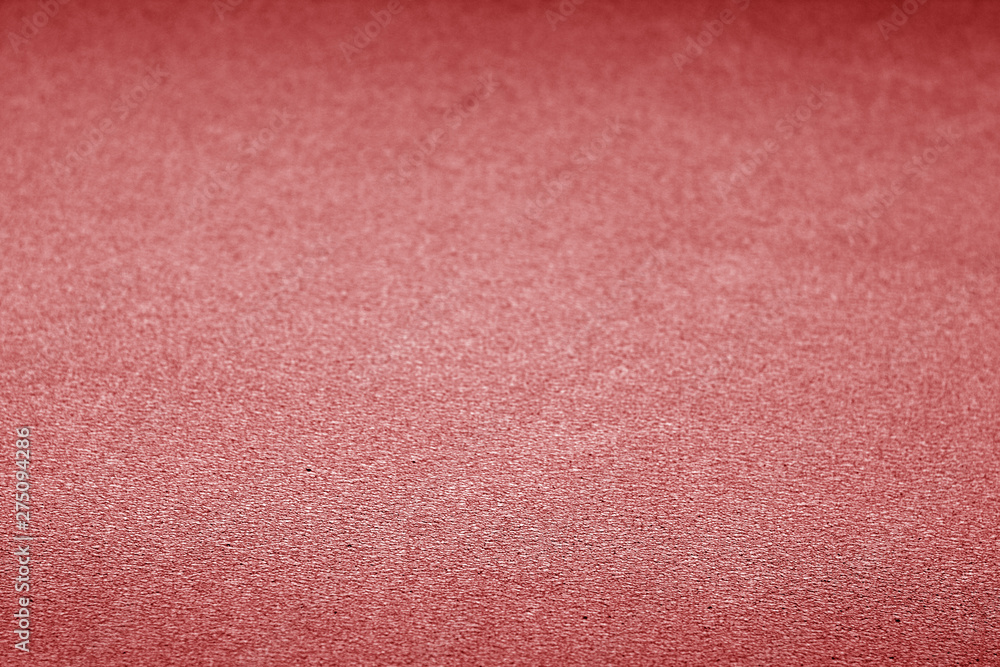 Fototapeta premium Plastic glittering texture with blur effect in red color.