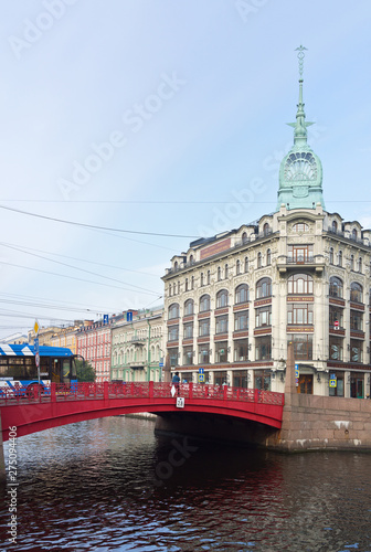 Saint Petersburg. The view from the embankment of the Moika River to Red Bridge (Krasny Most) on Gorokhovaya Street and the spire of Esders Trading House photo