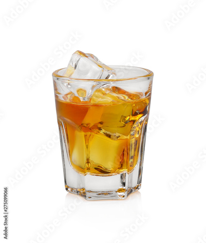Glass of scotch whiskey and ice on white background