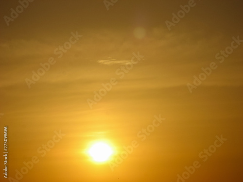  Sunset sky abstract background. Yellow sunset sky over the sea. Golden time of sky at sunset - sunrise time in summer season