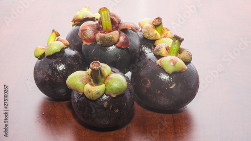 Tropical fruits mangosteen on the wooden table