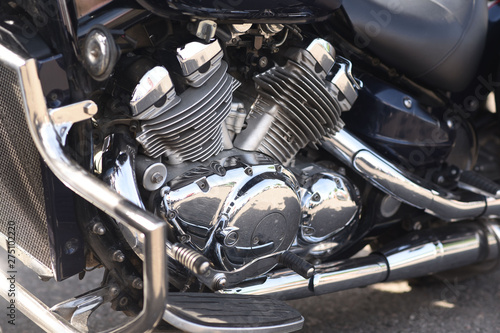 A motorbike on the show with chrome details and other parts, closeup with depth of field openair