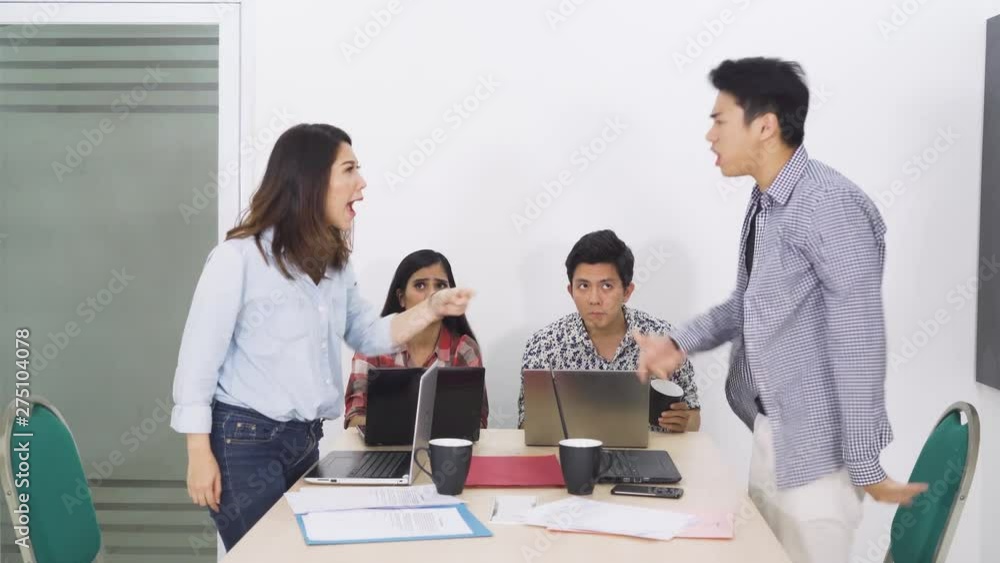 Young casual businesspeople having conflict and arguing during business meeting in office room. Shot in 4k resolution Young casual businesspeople having conflict and arguing during business meeting in office room. Shot in 4k resolution