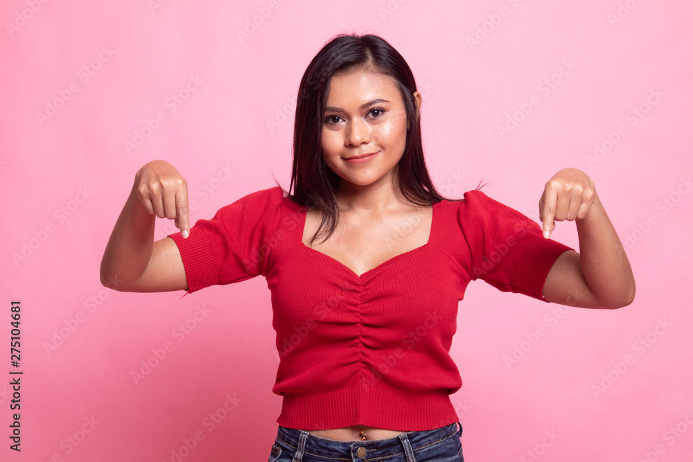 Beautiful young Asian woman point down to blank space. Beautiful young Asian woman point down to blank space.