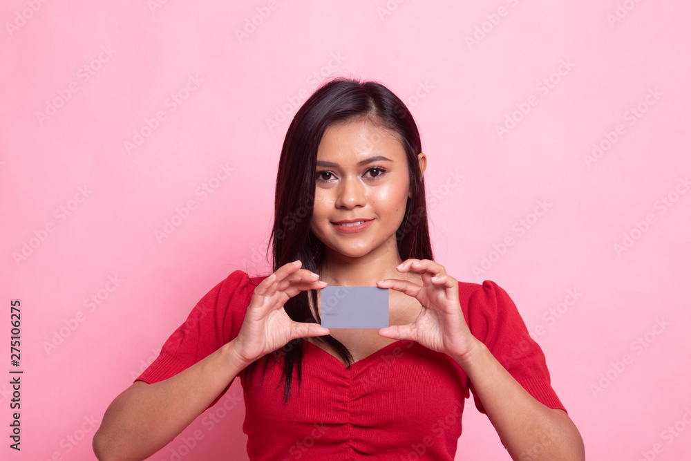 Young Asian woman smile with blank card. Young Asian woman smile with blank card.