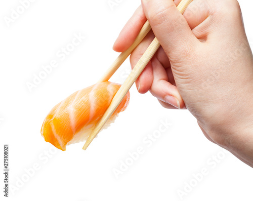 chopsticks hold sake nigiri sush with salmon