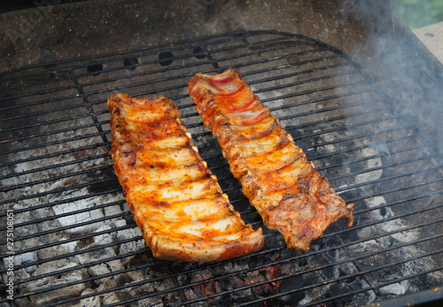 Pork ribs BBQ barbecue grill close-up.