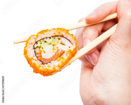 chopsticks holds california ebi roll close up photo