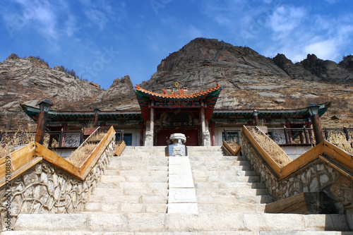 Stairway to the entrance of Aryapala Meditation Center with a board saying Aryapala Meditation Center, Gorkhi-Terelj National Park, Mongolia.