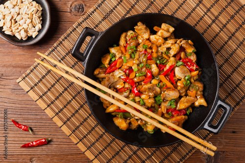 Chicken kung pao. Fried chicken pieces with peanuts and peppers.