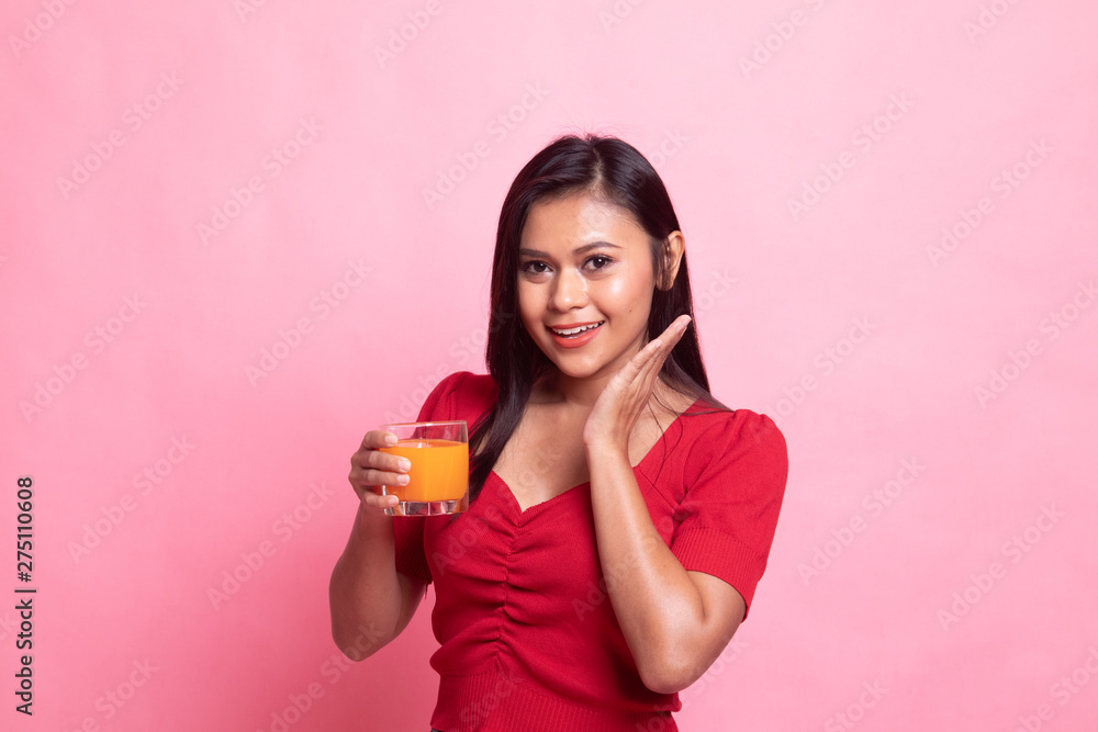 Happy Young Asian woman drink orange juice. Happy Young Asian woman drink orange juice.