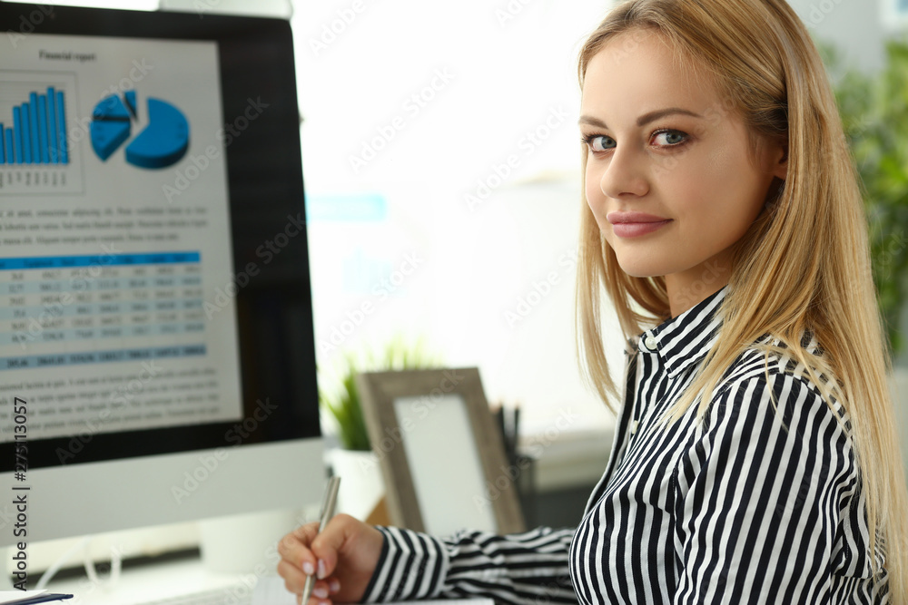 Businesswoman portrait sit at table with desktop Businesswoman portrait sit at table with desktop
