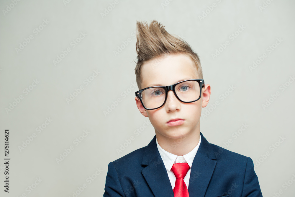 Portrait of a young businessman in big glasses and stylish suit Portrait of a young businessman in big glasses and stylish suit