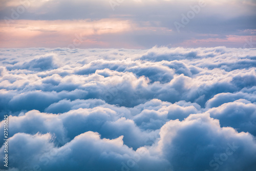 Fototapeta View of the clouds from above at dawn