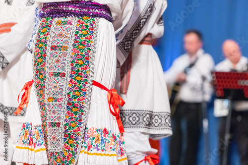 Detail of traditional folkloric costume of Romanian dancers perform a folk dance. Folklore of Romania