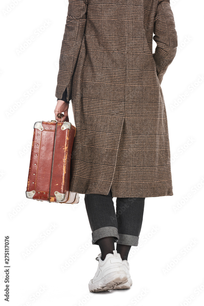 back view of woman in plaid coat holding vintage weathered suitcase isolated on white back view of woman in plaid coat holding vintage weathered suitcase isolated on white