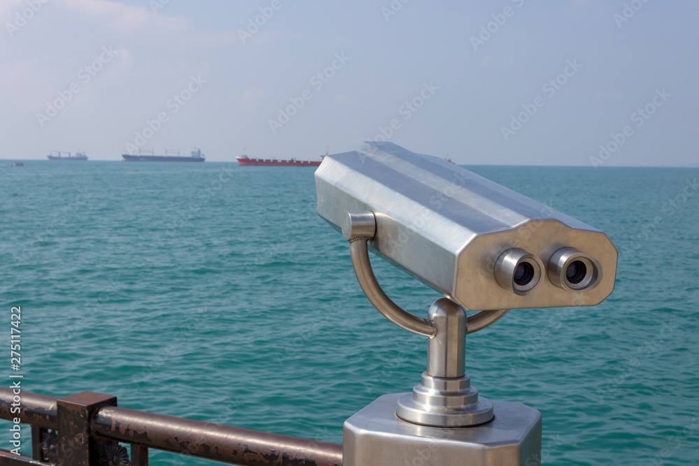 Looking At The Sea With Coin-Operated Binoculars.