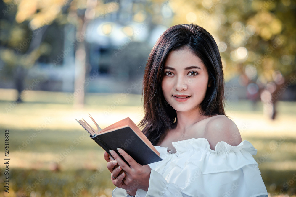 Fototapeta premium One women in Public park drink coffee and read a book