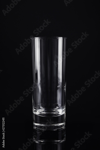 New empty tall glass on black background