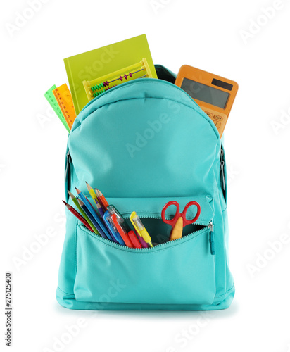 Bright backpack with school stationery isolated on white photo