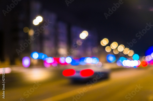 Abstract blurred background of night city.Night traffic,colorful lights