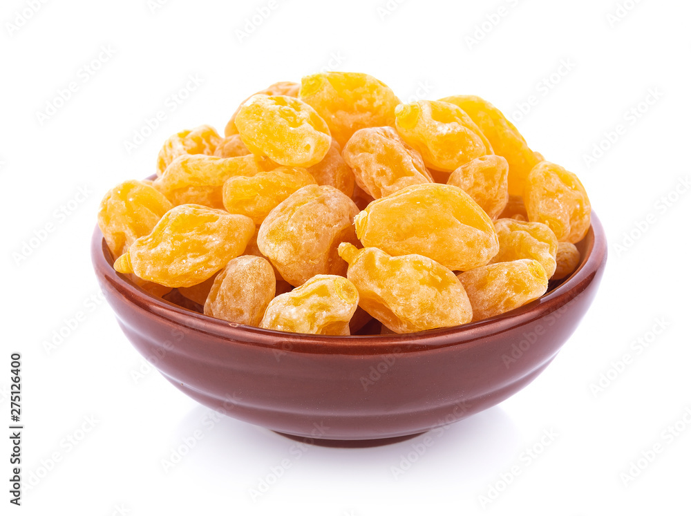 Dry yellow plums in bowl on white background. top view Dry yellow plums in bowl on white background. top view