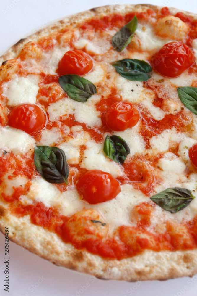 Margherita Pizza is a typical pizza from Naples, made with tomatoes, cheese,fresh basil, salt and olive oil. Traditionally, it is made with fior di latte rather than buffalo mozzarella. Margherita Pizza is a typical pizza from Naples, made with tomatoes, cheese,fresh basil, salt and olive oil. Traditionally, it is made with fior di latte rather than buffalo mozzarella.