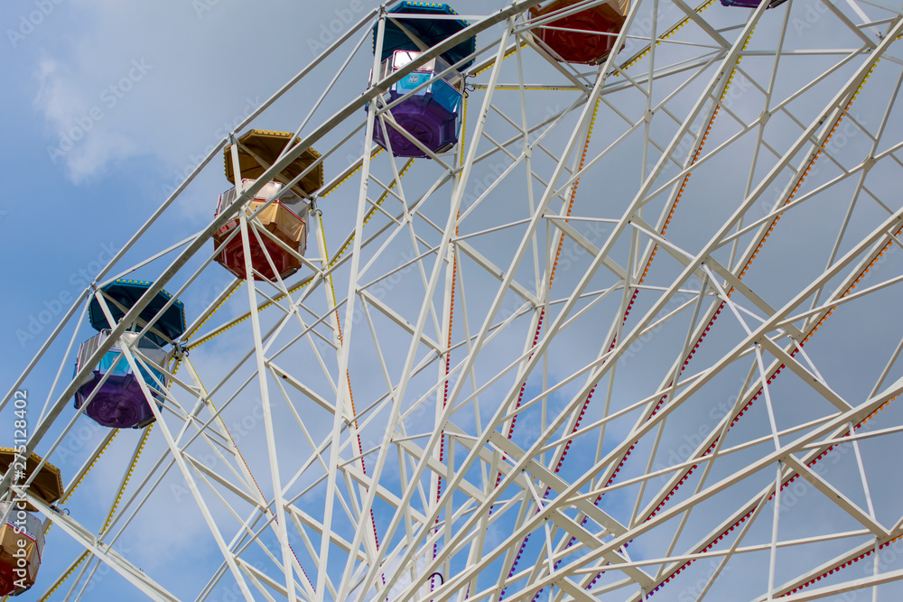 Ferris wheel in the amusement Park with storm gray clouds in the sky. Ferris wheel in the amusement Park with storm gray clouds in the sky.
