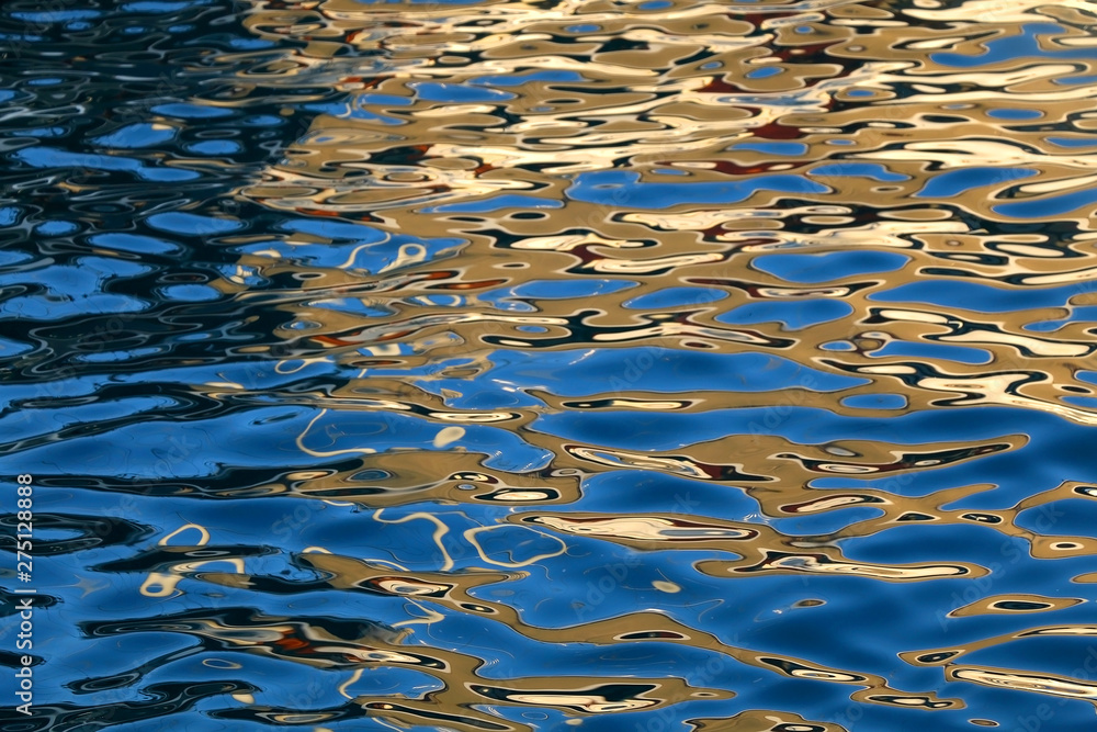 Golden reflections on the sea surface at sunset. Selective focus. Golden reflections on the sea surface at sunset. Selective focus.