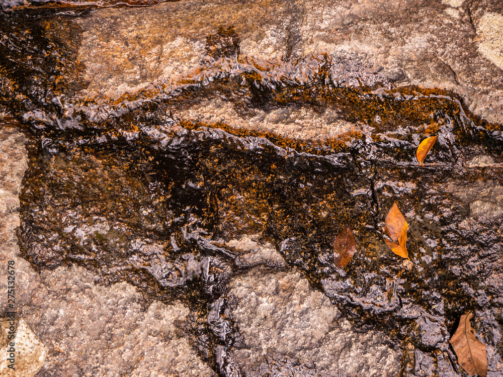 The texture of water on the waterfall. underwater rocks The texture of water on the waterfall. underwater rocks