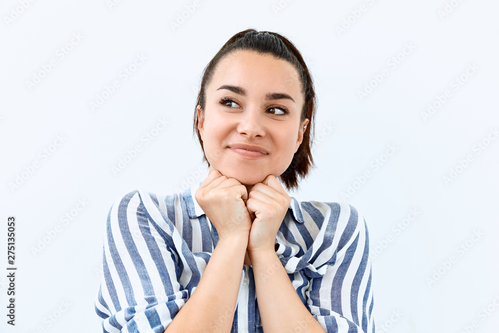 Dreamy,pleased, thinking emotion . Wish concept. Brunette girl face portrait on white backgound. Dreamy,pleased, thinking emotion . Wish concept. Brunette girl face portrait on white backgound.