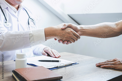 Doctor having shaking hands to congrats with patient after recommend treatment while discussing explaining his symptoms and counsel diagnosis health, healthcare and assistance concept