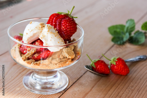 dessert in a glass of cookies, strawberries and cottage cheese