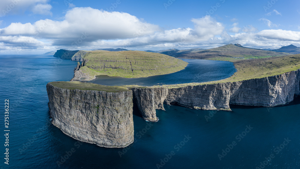Leitisvatn lake and Tralanipan-slave rock, near Bosdalafossur waterfall on Vagar, Faroe Islands - obrazy, fototapety, plakaty 