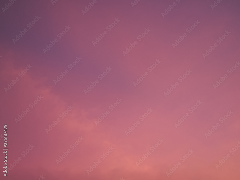 Fototapeta premium Twilight cloudy sky background, view of cloudy sky painted with red sun light after sunset.