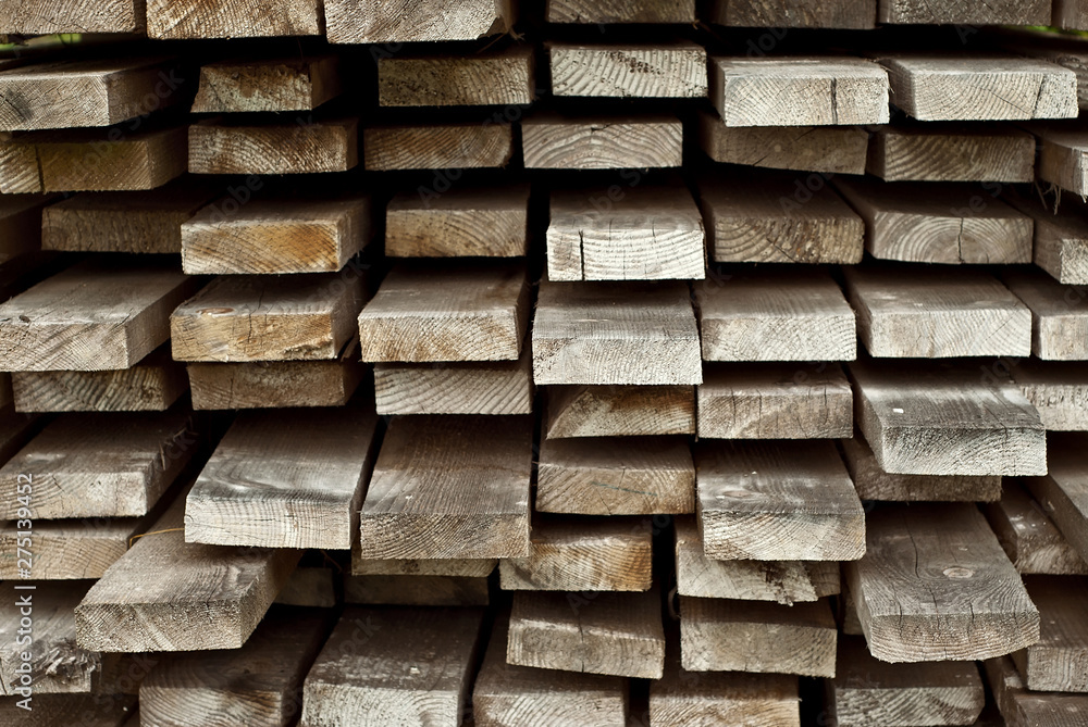Many wooden boards are in the column. The wooden boards are dried out in the open air Many wooden boards are in the column. The wooden boards are dried out in the open air