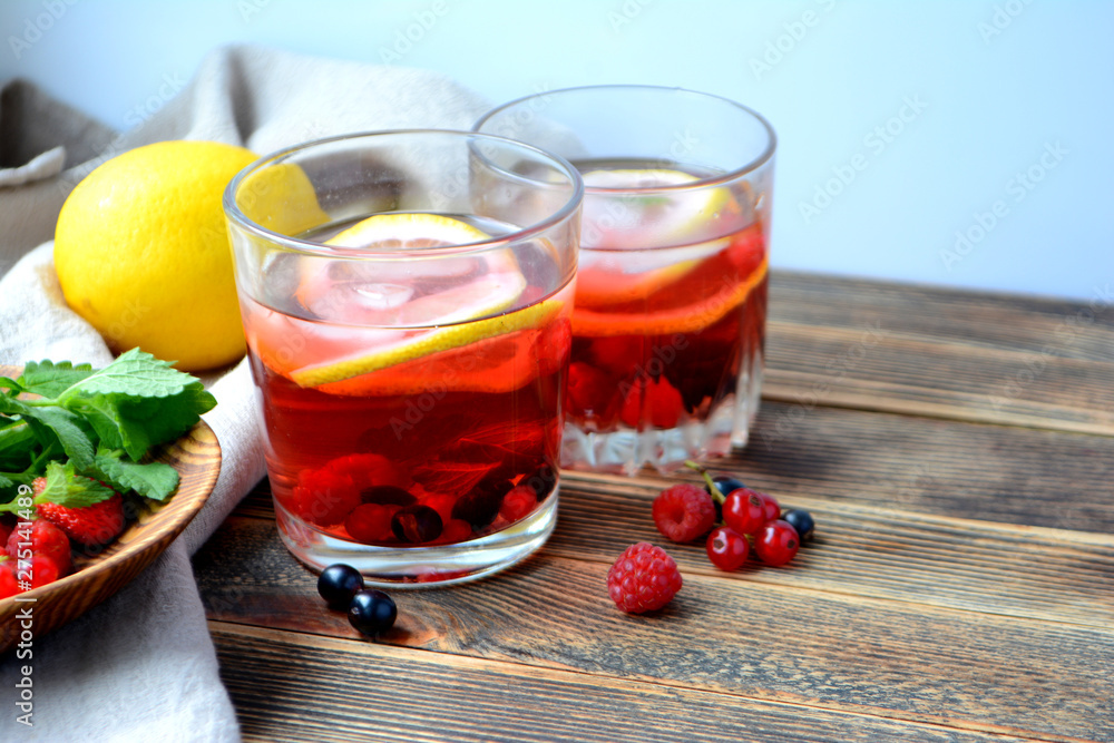 Cold berry lemonade in glasses Summer refreshing drink Cold berry lemonade in glasses Summer refreshing drink