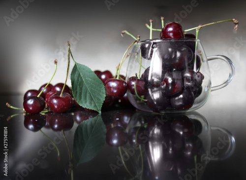Red ripe cherry lying on the table