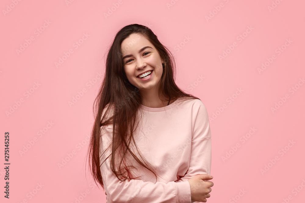 Laughing teenager with folded arms Laughing teenager with folded arms