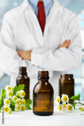 Фотография Herbalist with aromatherapy oils, natural medicine