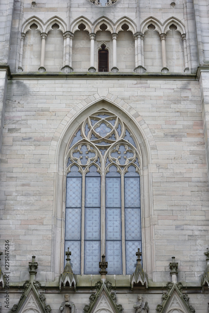 Beautiful, high and pointed window in the Evangelical Church in Germany. Exterior of the evangelical church