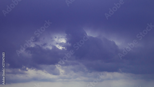 Dark blue cloudy sky as a background