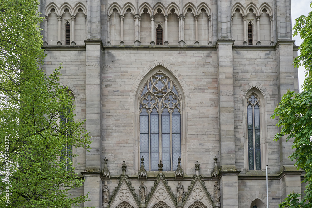 Beautiful, high and pointed window in the Evangelical Church in Germany. Exterior of the evangelical church