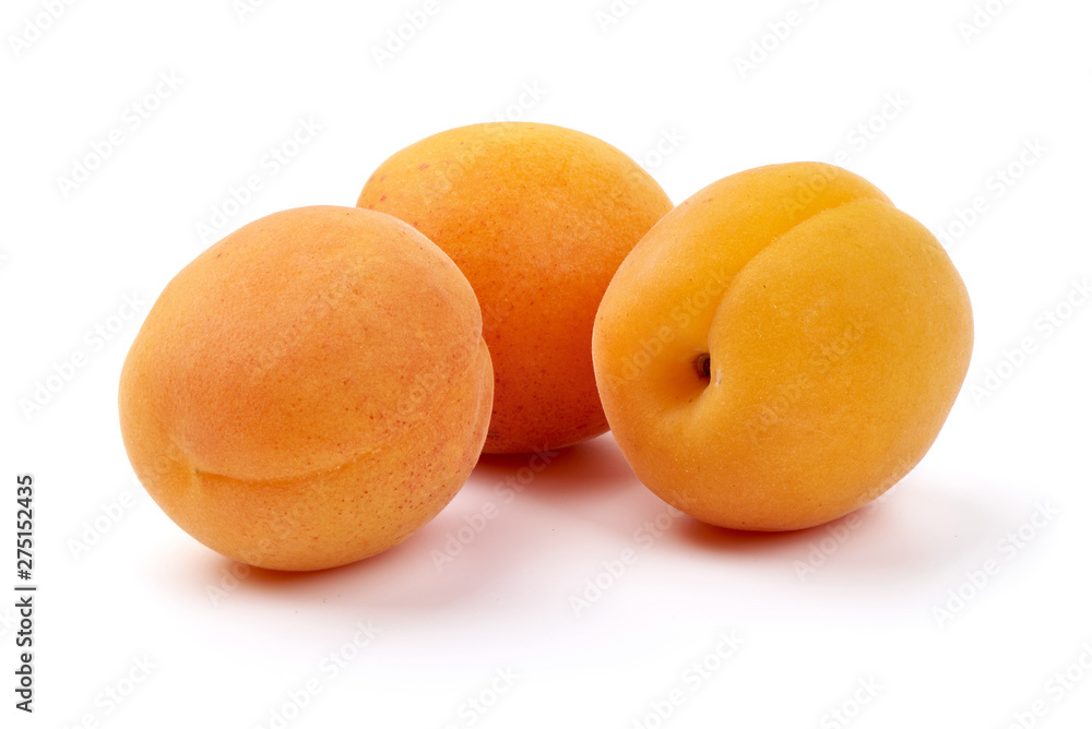 Sweet juicy apricots, ripe nectarines, close-up, isolated on white background Sweet juicy apricots, ripe nectarines, close-up, isolated on white background