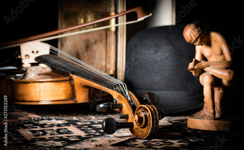 detail violin - still life with a wooden figure, color version, due to the character contains grain / noise ratio and enhanced details